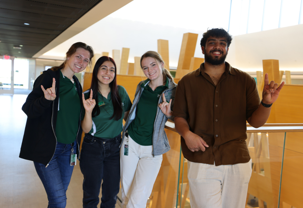 Honors Ambassadors Kinsey Roth, Nusheen Immen, Gabby Carroll, and Aakash Vijeesh pose in the Judy Genshaft Honors College