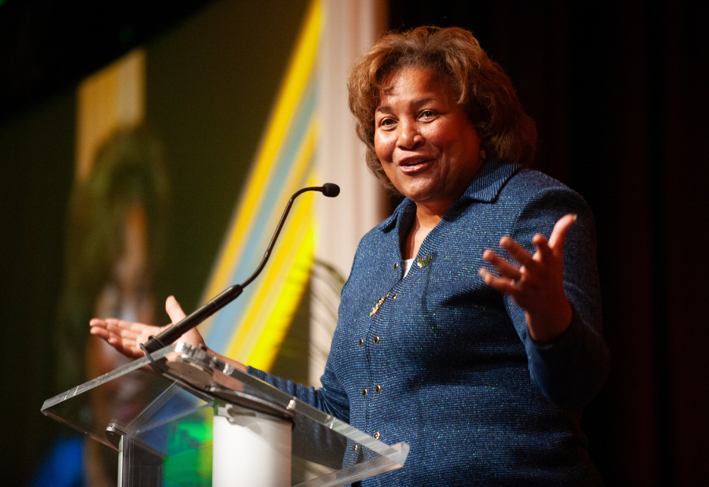 Judge Julianna Michelle Childs stands at a podium delivering a speech at the University of South Florida.