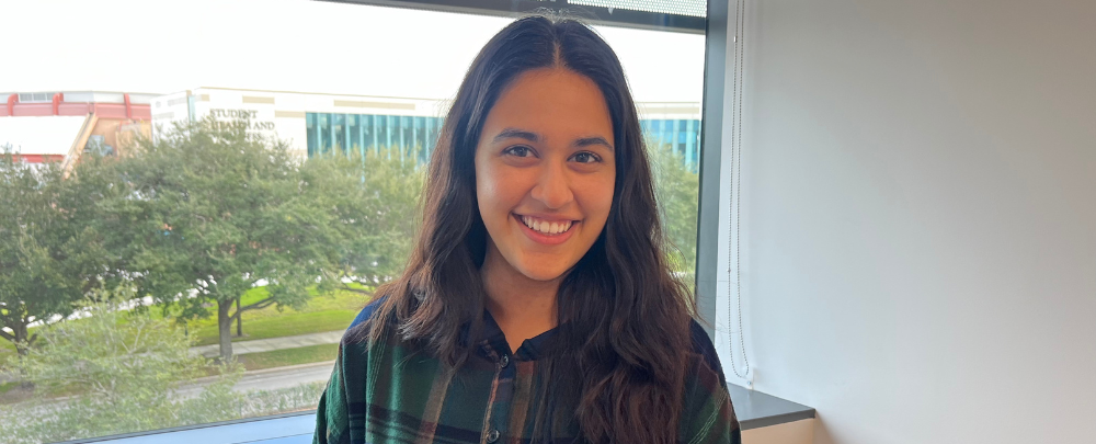 Honors student Amna Wahjat smiles in the IT suite