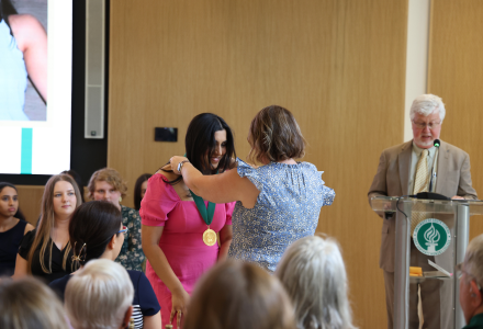 Honors graduate Neha Dantuluri receives her Honors Medallion