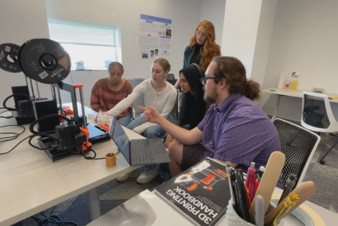 USF honors students work with Professor Tina Piracci and Dr. William Ellis to engineer oyster bricks. 