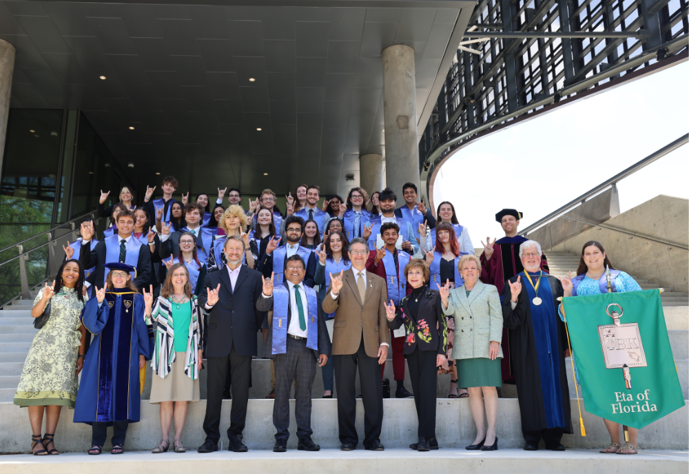 University of South Florida leaders including President Rhea Law, Dr. Judy Genshaft, Steven Greenbaum, and Provost Prasant Mohapatra smile with the class of 2024 USF PBK inductees.