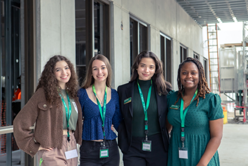 USF Sarasota-Manatee students smile outside of the new residence halls.