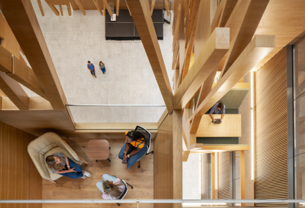 Photo looking from an upper level looking downward into the Judy Genahsft Honors College atrium and learning lofts.