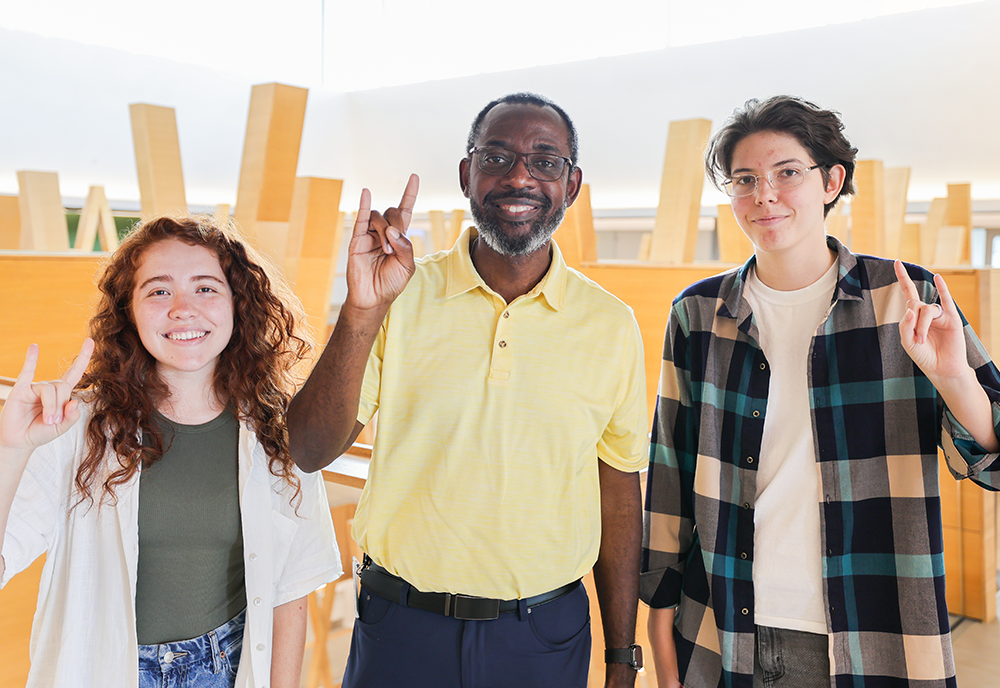 Sofia Mitsuyuki, Dr. Reginald Lucien, and Anzhelika Kurnikova in the Honors building