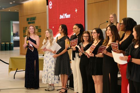 Honors Got Talent 2025 performers stand at the front as winners are chosen and given trophies.