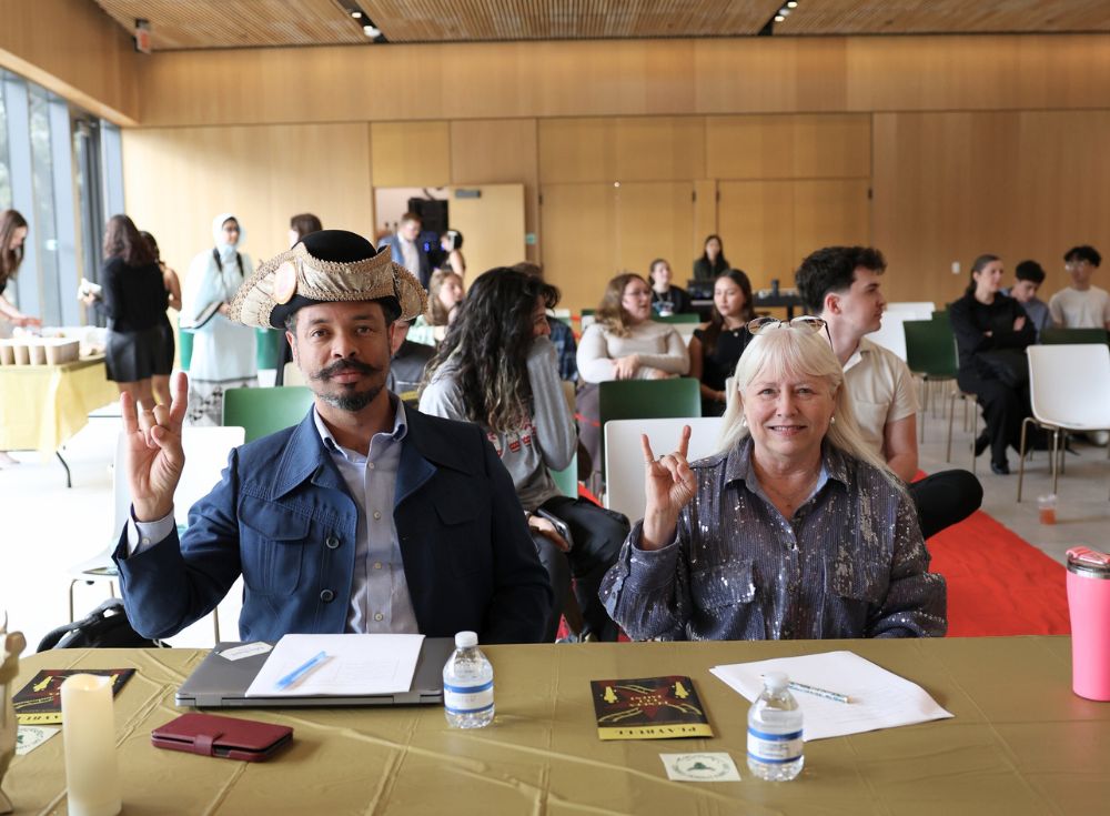 Dr. Michael Cross and Joan Fields show their bull pride at the judges' table.