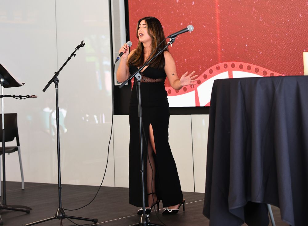 Sue Lee, singing "Chasing Pavements" by Adele