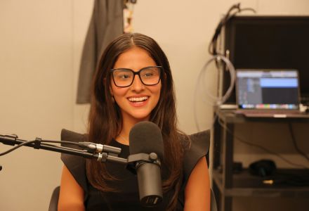 Anabella Garcia chatting into a mic in the Honors AV studio