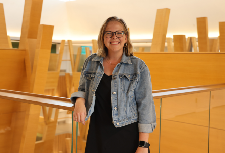 Melanie Ryerson, a licensed mental health counselor and Honors affiliate professor smiles in the Judy Genshaft Honors College building.