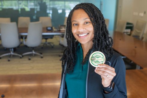 Jataya Jackson holding USF Health Culture Champion Award.