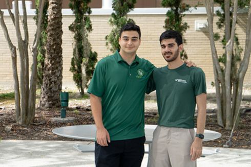 CyberHerd team members pose outside on USF campus