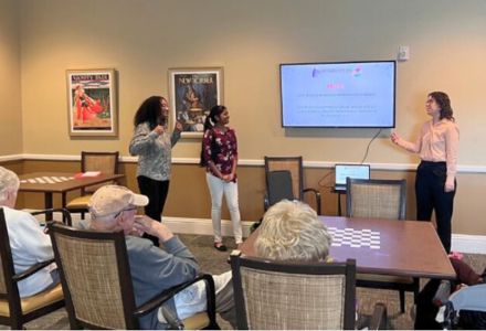 Florida MedConnect volunteers sharing health information with a senior living community.