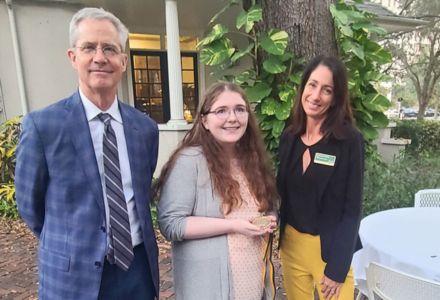Dr. Thomas Smith, Grace Blackard with her honors medallion, and Dr. Catherine Wilkins
