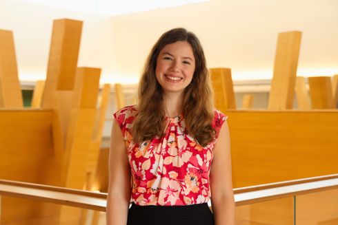 Heather Stroup poses on the 5th floor of the Judy Genshaft Honors College building.