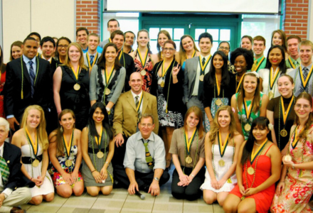 Members of the 2012 USF Honors College Graduating Class pose together with Dean Stuart Silverman while wearing Honors Medallions.