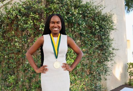 K'yana Edwards posing with her honors medallion