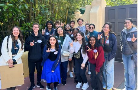 Tampa Honors LLC students show their bull pride while on a tour of Magic Kingdom with Disney Imagineer Allyson.