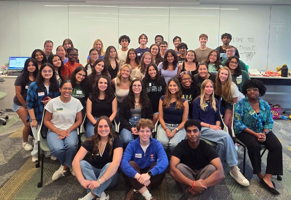 Honors peer mentors pose for a group photo in a classroom in the Honors building.