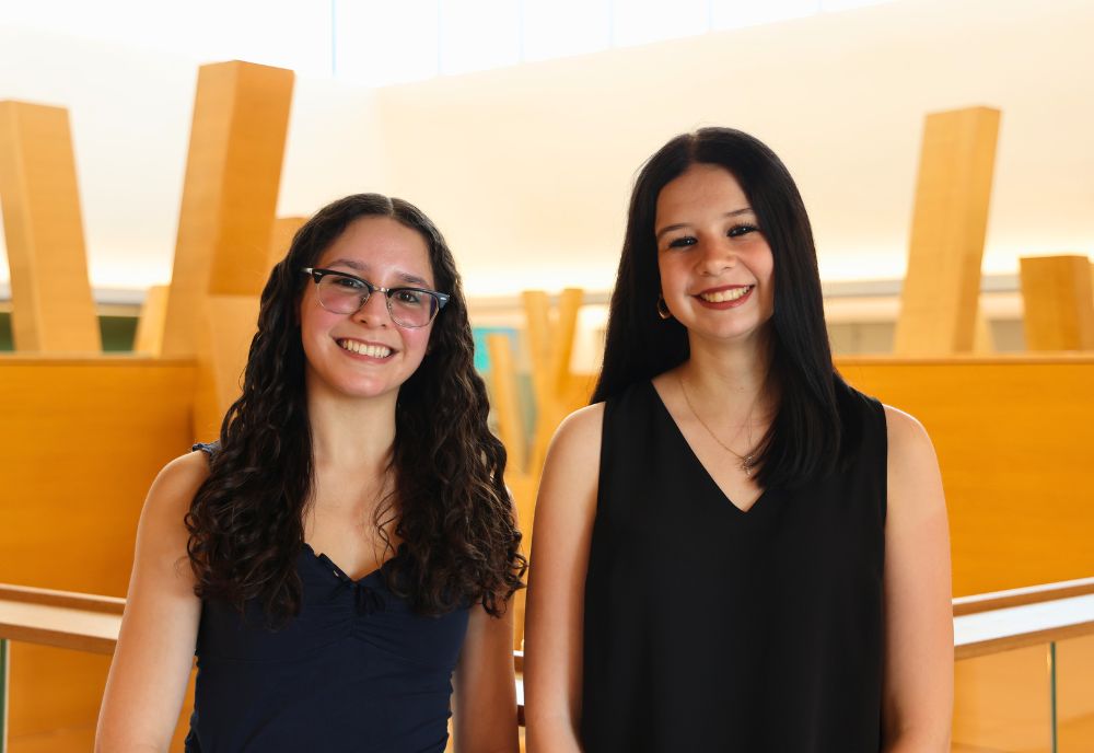 Olivia Pinilla and Katelynn Paciorek pose on the fifth floor of the Honors building.