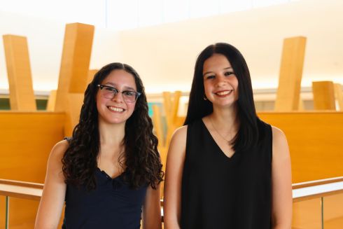 Olivia Pinilla and Katelynn Paciorek pose on the fifth floor of the Honors building.