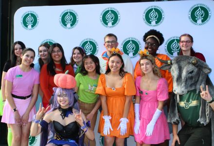 The Honors Student Council celebrates in costume at the fall 2024 Bull Bash event.