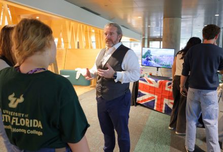 Dr. Benjamin Young shares about USF in London and Semester in Exeter at the England booth on the second floor of the Honors building.