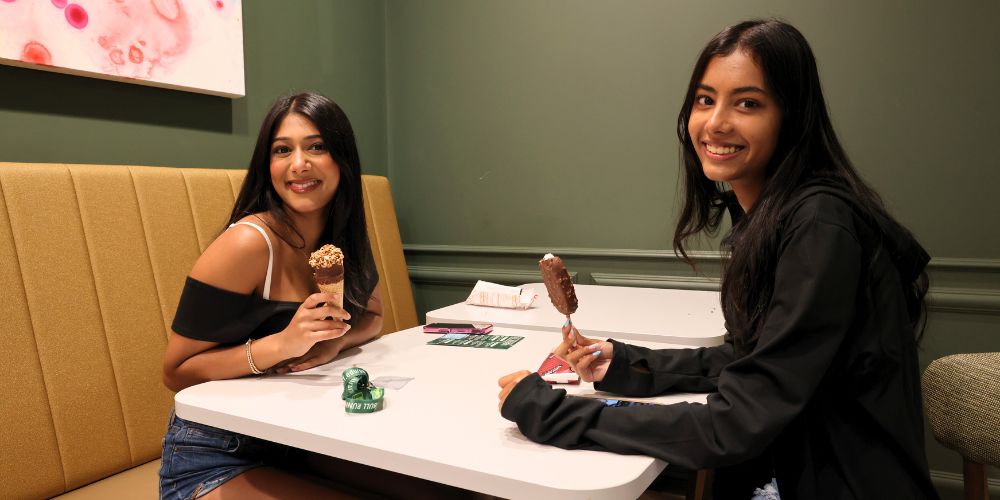 Honors students pose with their ice cream treats on the first floor cafe in the Honors building.