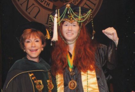 Zita Fletcher posing with Judy Genshaft for a graduation photo