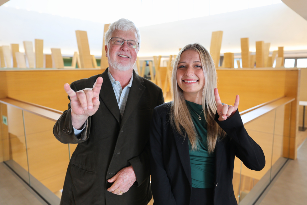 Ava Tucker and Dean Adams in Honors building