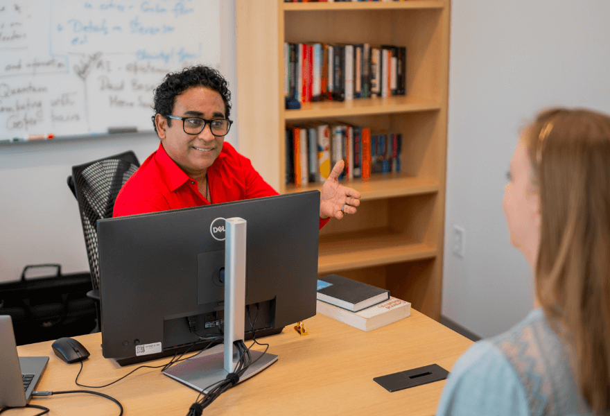 Dr. Sayandeb Basu advising a student in the Office of National Scholars