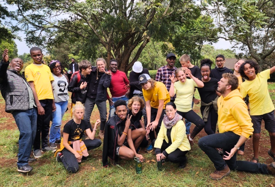 Christopher Johnson strikes a pose with Woodland Star International School during his first year as high school principal