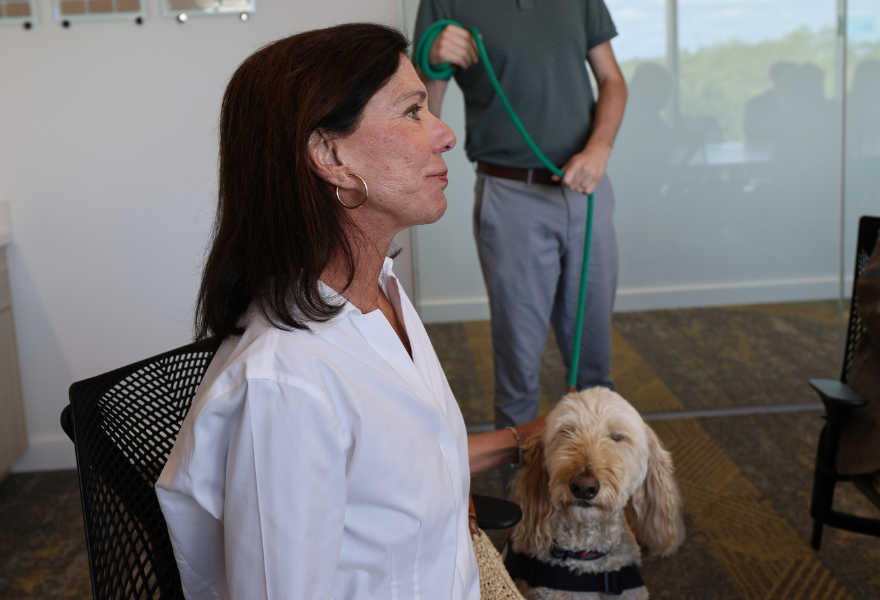 Claudia McCorkle next to Beau (doodle)