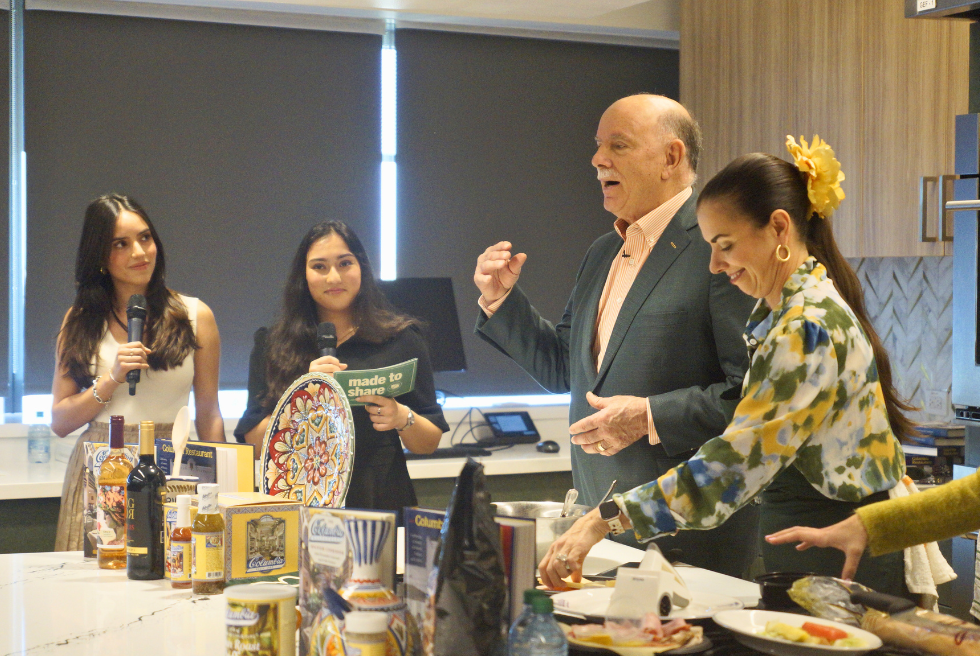 Honors student hosts Fabiana Requena and Reva Gandhi, Richard Gonzmart, and Andrea Gonzmart cook in the Leona Genshaft Food and Culture Studio