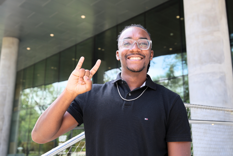 DJ Bernadotte on steps of Judy Genshaft Honors College amphitheater