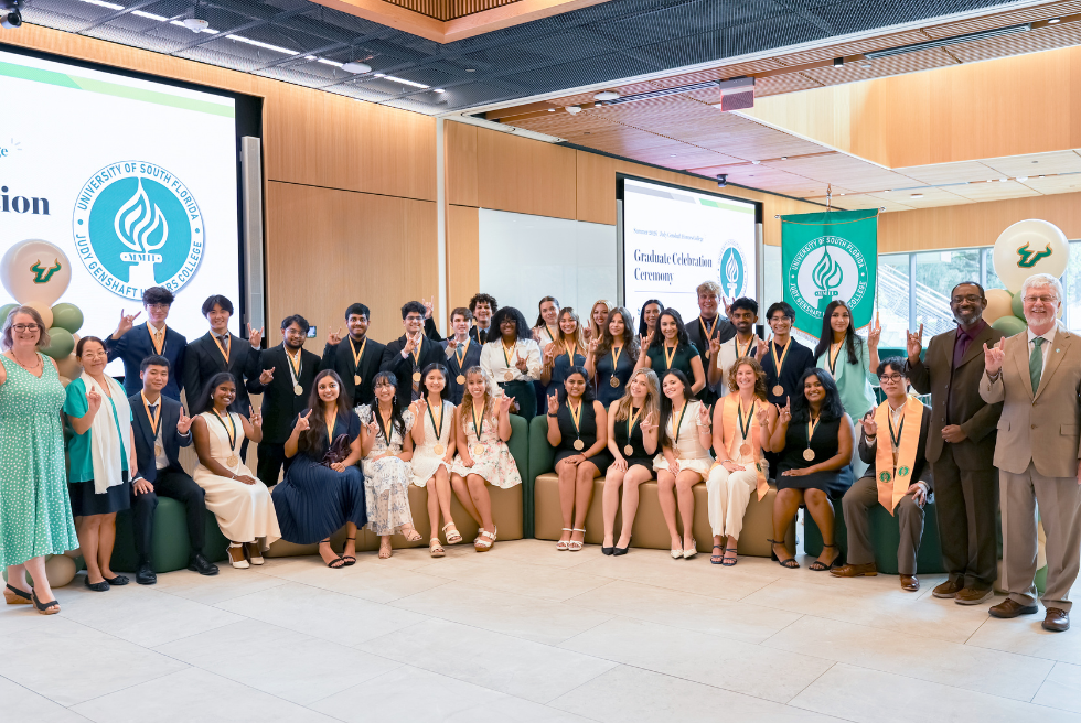 2026 Summer graduates and Honors College deans in Zimmerman Family Atrium
