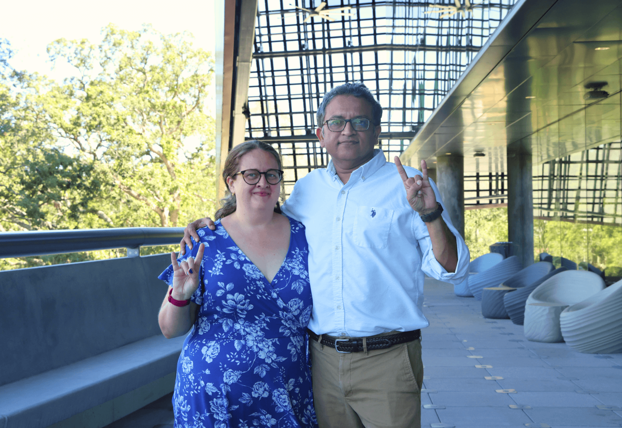 Holly and Deepak Singh on the terrace of the Judy Genshaft Honors College building