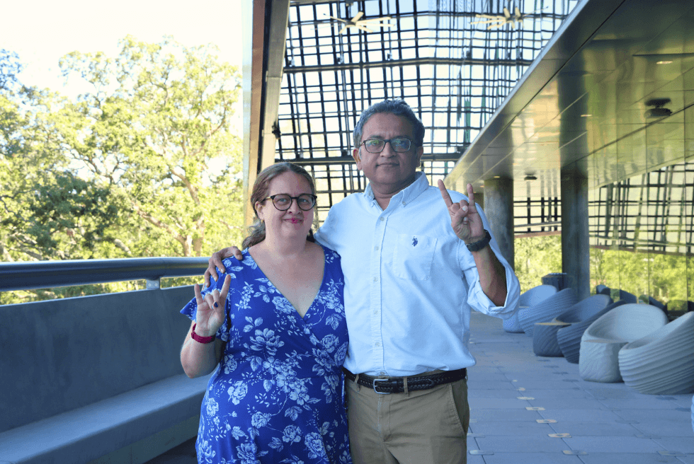 Holly and Deepak Singh on the terrace of the Judy Genshaft Honors College building