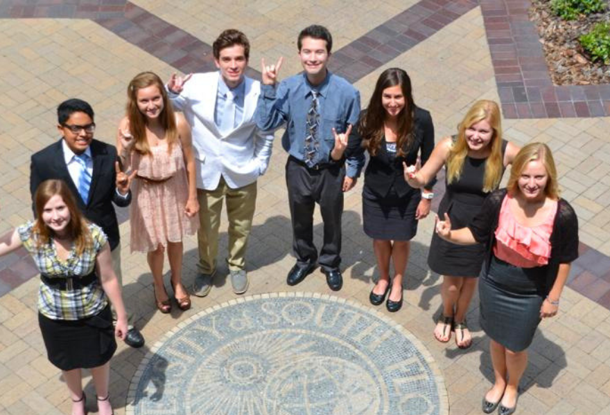 Jason Rodencal and other Judy Genshaft Honors College students at the John and Grace Allen building.