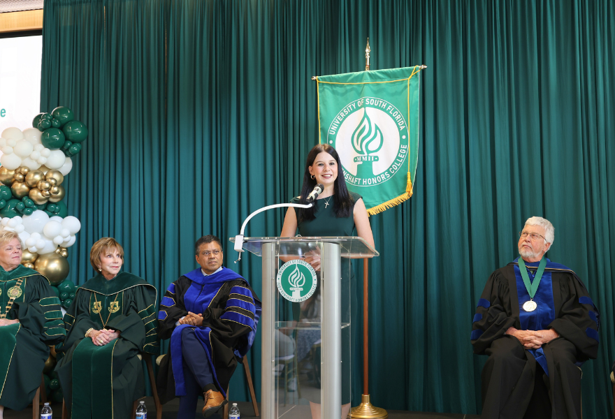 Katelynn Paciorek speaks at the Judy Genshaft Honors College 2025 Convocation Ceremony.