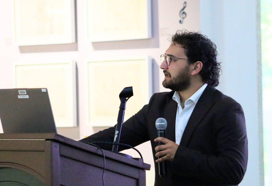 Laczko presenting at podium