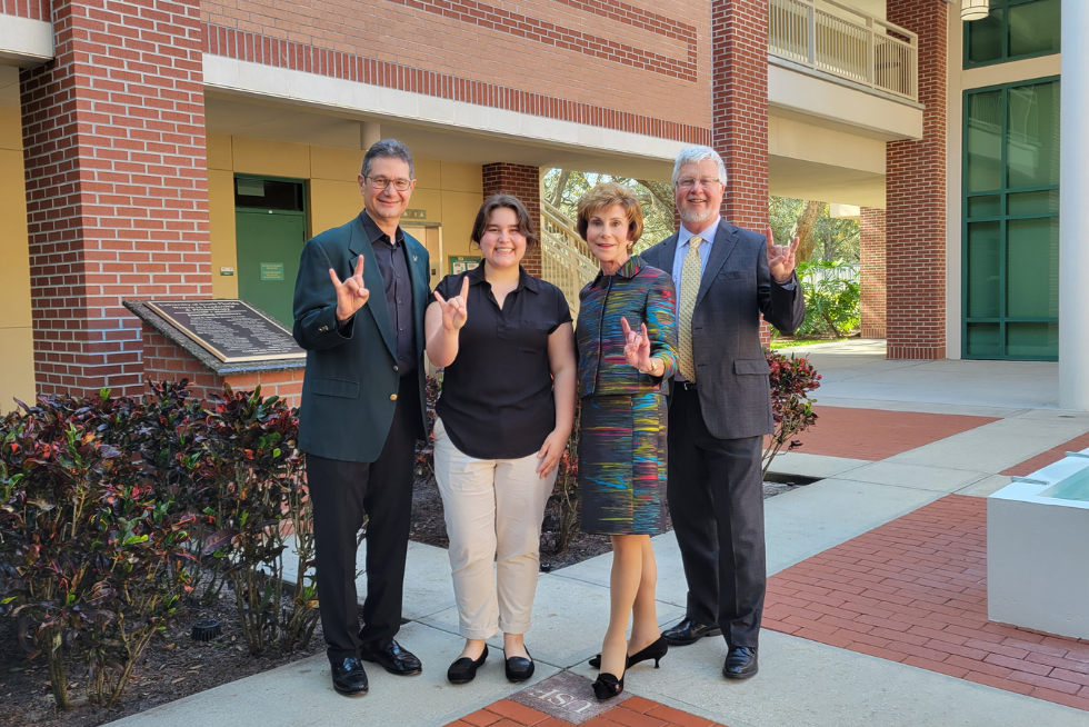 Reni Poston-Hymel posing with President Emerita Judy Genshaft, Dean CharlesAdams, and Steven Greenbaum.