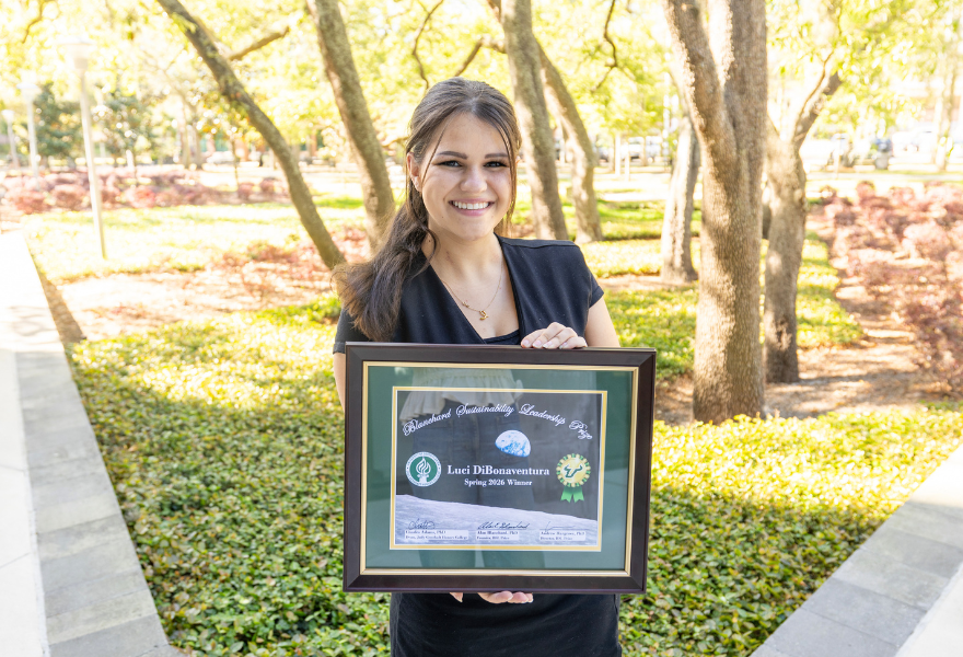 Luci DiBonaventura outside with certificate