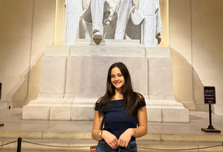 Madison poses in front of Abraham Lincoln Memorial