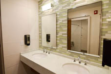 two sinks with mirrors above