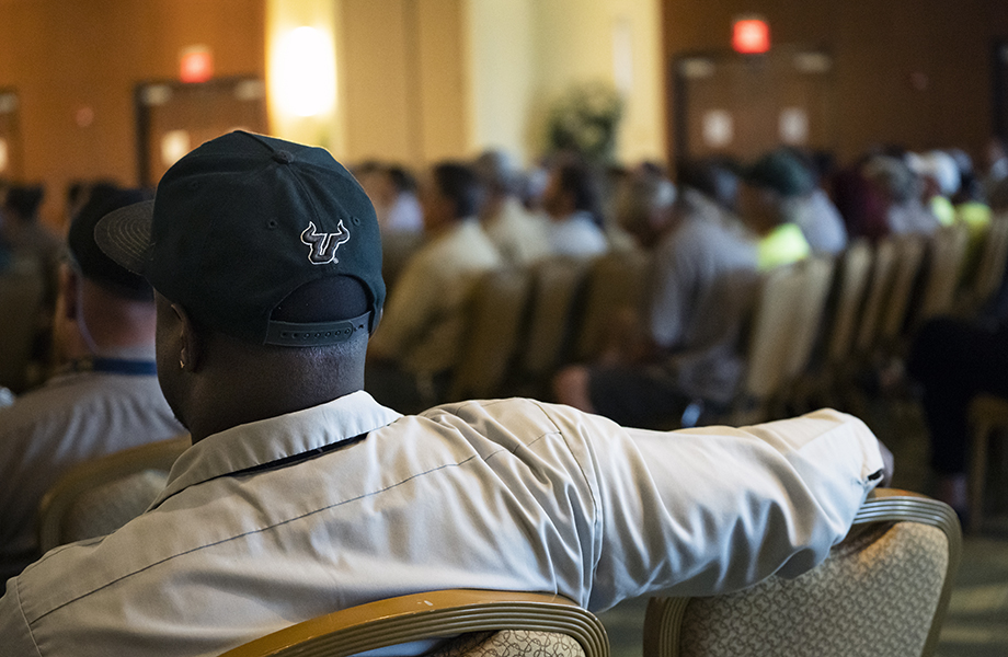 USF employees sitting at a town hall event.