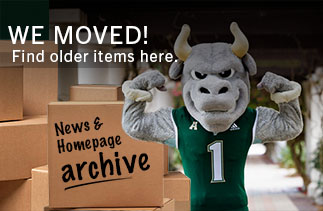Rocky flexing with moving boxes. Text says we moved. Find older items here. News & homepage archive.