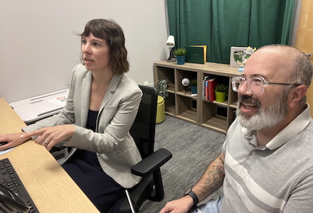 two people at desk working