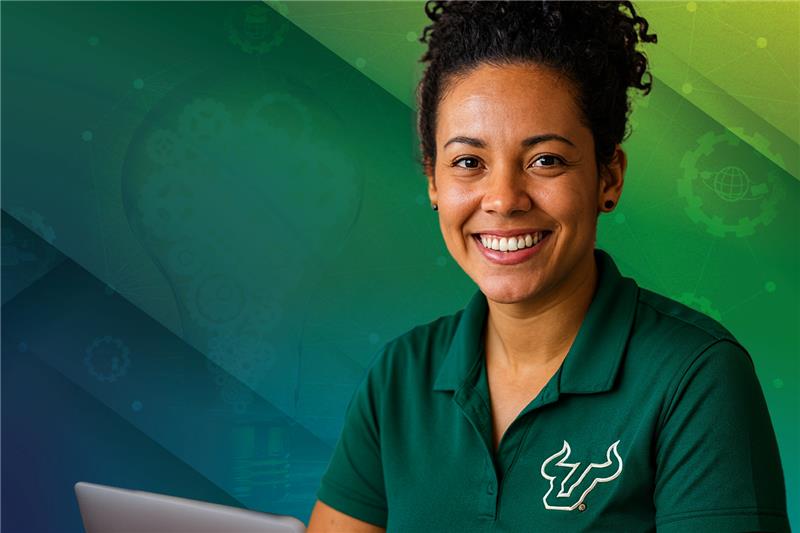 woman with usf shirt smiling at camera with laptop 