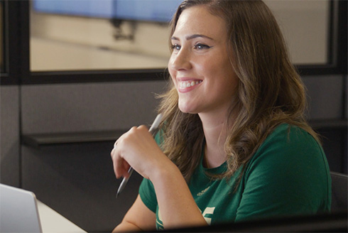 Haley smiles looking at computer